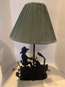 lot 2249 image: Table lamp. Approximately 31 inches tall. Has a farmer on a tractor cut out