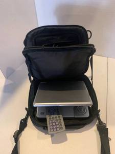 lot 2254 image: Axion portable DVD player with cords and remote