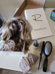 lot 2422 image: Ladies wig, brushes, spray wig conditioner