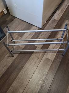 lot 2429 image: Aluminum shoe rack extends to 45 inches wide