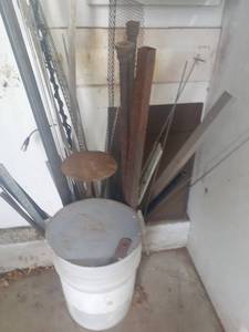 lot 3005 image: Bucket of scrap metal plus 2 sheets against wall