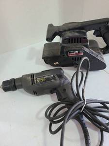 lot 3229 image: Craftsman belt sander and electric drill.