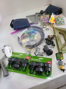 lot 3238 image: Sprinklers, hose repair parts and more.