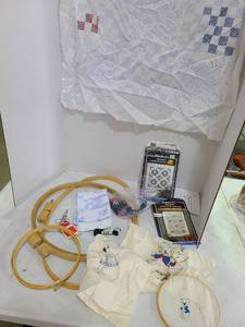 lot 3303 image: Embroidery hoops, patterns, thread.
