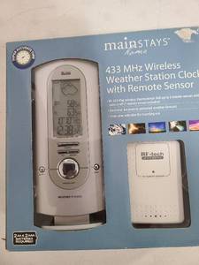 lot 3315 image: Wireless weather station clock with remote sensor.