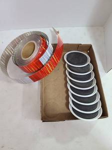 lot 3320 image: Roll of red and silver reflective paper and furniture sliders