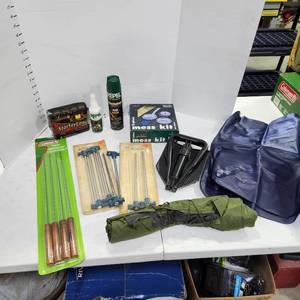 lot 3401 image: Tent stakes, wood firestarter, mess kit, skewers and tri fold shovel