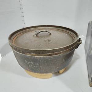 lot 3406 image: Lodge cast iron 12 in 6 quart outdoor Dutch oven