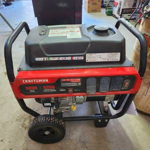 lot 3500 image: Craftsman 5000 watt generator with Briggs & Stratton Powerbuilt 306cc engine like new has gasoline in tank heavy