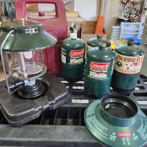 lot 3504 image: Coleman propane lantern with case (appears new) and 4 refillable propane empty bottles