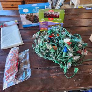 lot 3515 image: Holiday lights (2 are new in box), garland and tree removal bag