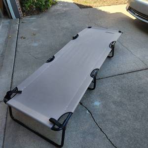lot 3517 image: Coleman beige folding cot good condition