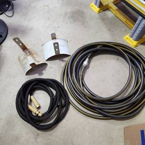 lot 3629 image: 2 garden hoses and 2 holders