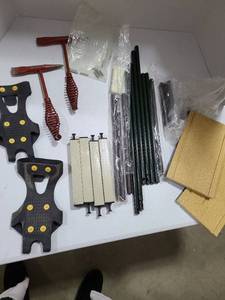 lot 3704 image: Two welding red spring handle chipping chisel hammers, ice cleats, and more
