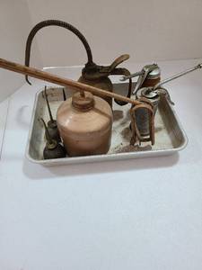 lot 3721 image: Variety of vintage oil cans in Pizza Hut cake pan