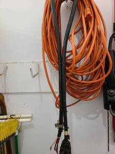 lot 3803 image: Two orange extension cords and a 4 prong dryer cord