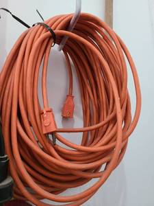 lot 3805 image: Long orange extension cord