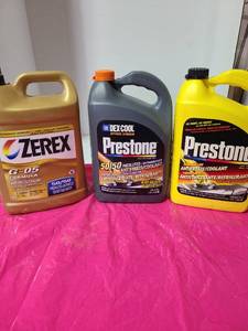 lot 3814 image: 3 jugs antifreeze, halfway full or more.
