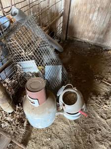 lot 4032 image: Small animal trap, propane tank, and other enamelware