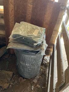 lot 4035 image: Metal trashcan full of tarps