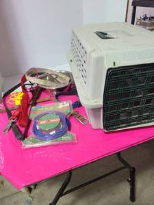 lot 3819 image: Pet taxi about 20 inches long, dog cable, water bowl, leashes, whistles