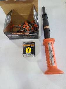 lot 3216 image: Remington powder actuated fastening tool with fasteners.
