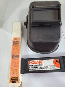 lot 3218 image: Welding helmet and welding rods