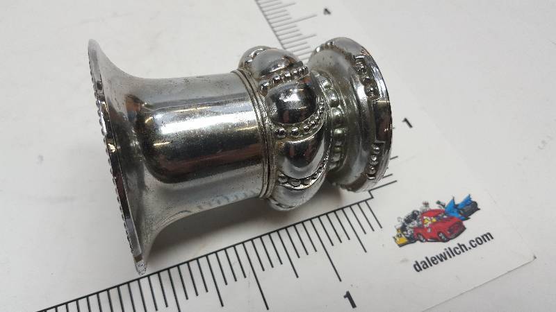 lot 6533 image: Again very heavy like Silver is this wild looking candle holder with ornate decoration