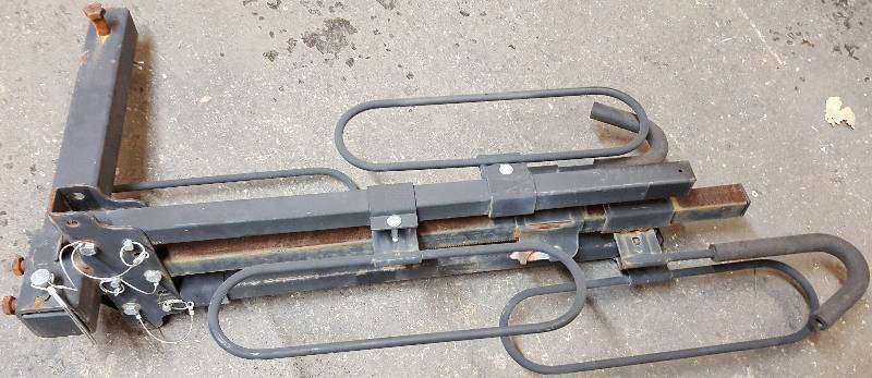 lot 6099 image: Cool 2 bike fold up carrying transportation rack that plugs into the Class III trailer hitch.