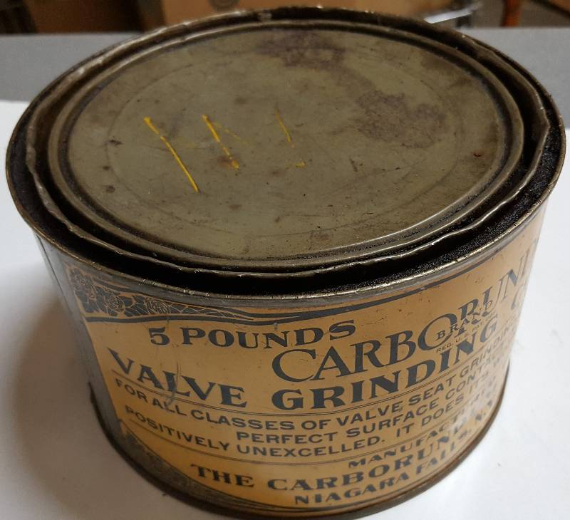 lot 6102 image: Started out as 5 lbs. and has had a little used in this cool old antique valve grinding compound metal can