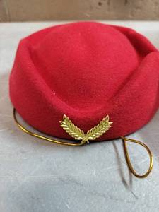 lot 1745 image: Small Red Cap With A Leaf Pendant