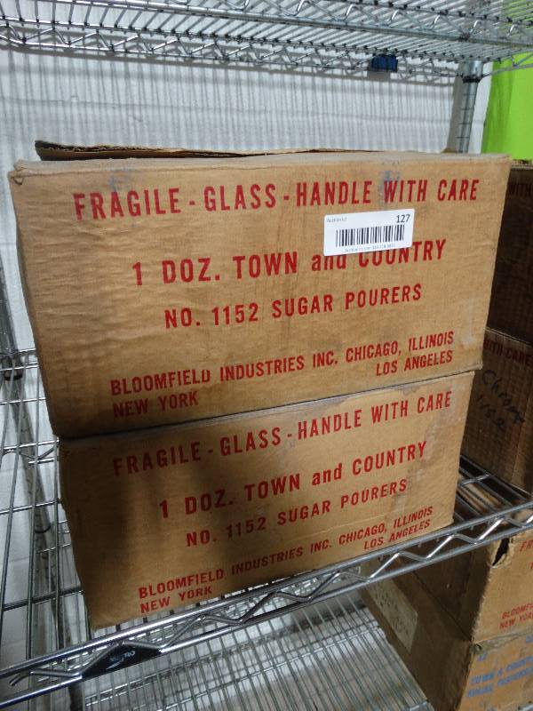 lot 127 image: 2 cases of unused sugar dispensers
