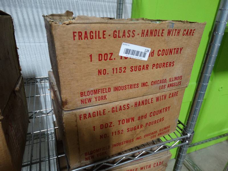 lot 128 image: 2 cases of unused sugar dispensers