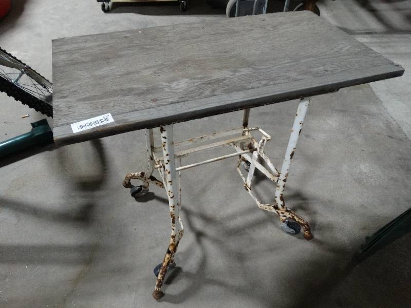 lot 219 image: Small shop table on wheels.