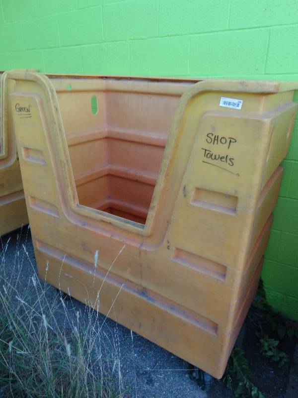 lot 236 image: Large plastic laundry cart on wheels.