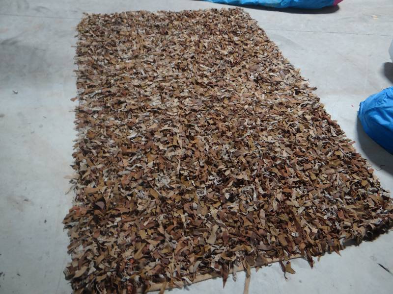 lot 266 image: Genuine Leather shag rug