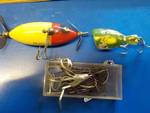 3 fishing lures 1 is a Heddon SOS and extra hooks