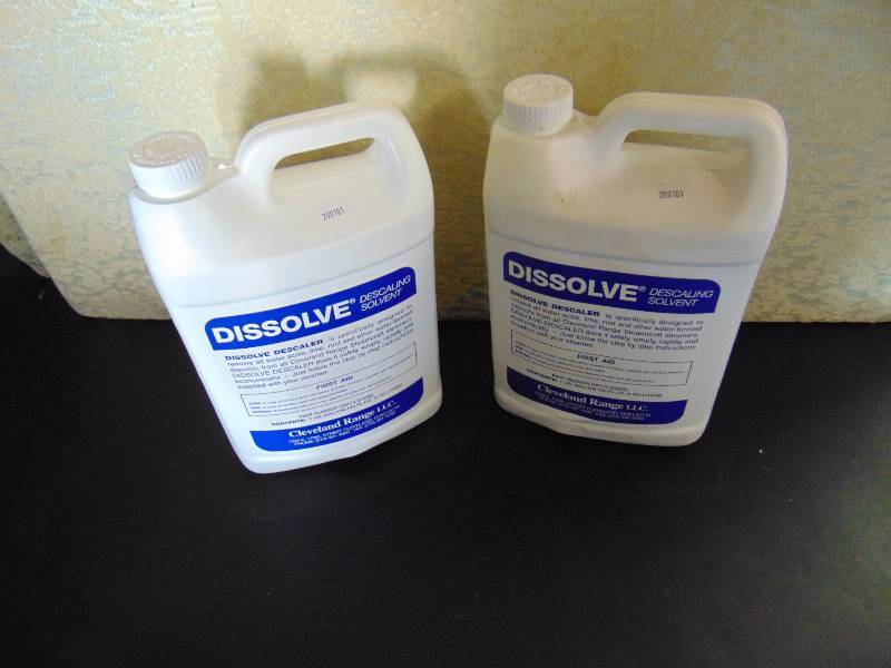 lot 4216 image: (2) gallons Dissolve Descaling Solvent, $60 value