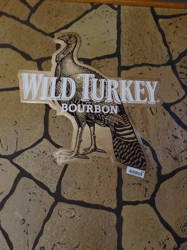 lot 408 image: Wild turkey bourbon metal sign.