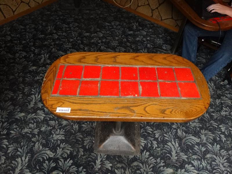lot 410 image: Small Oval heavy table with metal base.