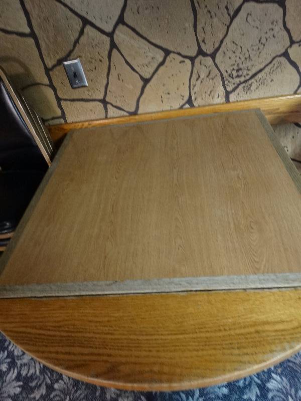 lot 424 image: Square table with metal base and drop leafs.