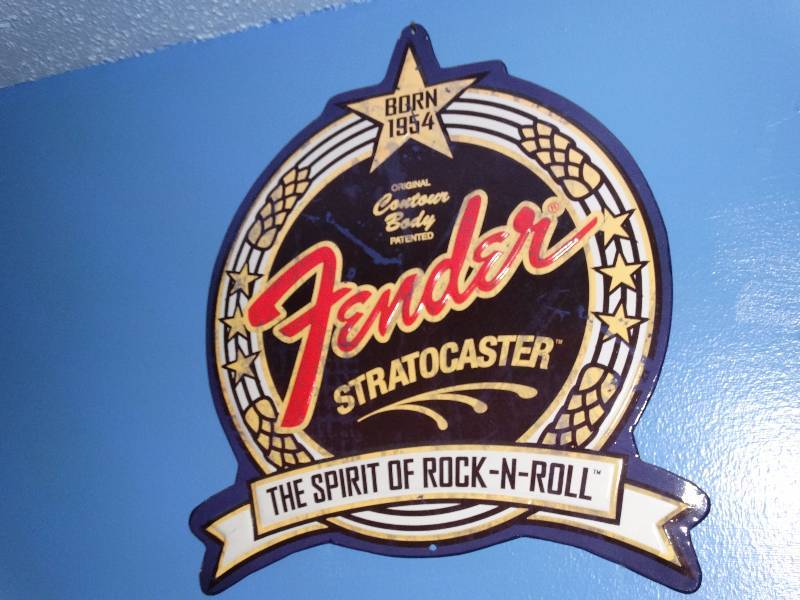 lot 519 image: Fender stratocaster metal sign.