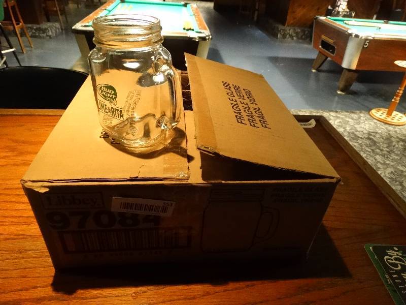 lot 553 image: Case of 12 Bud Light Lime-A-Rita mason jar style glass w handle