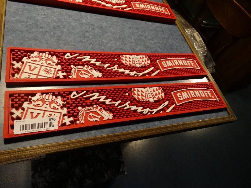 lot 676 image: 2 new Smirnoff bar mats