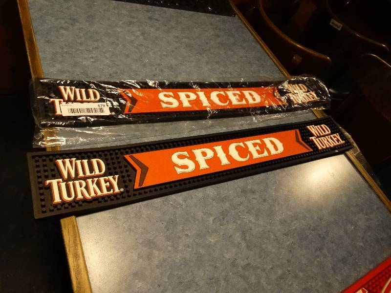 lot 679 image: 2 new Wild Turkey Spiced bar mats