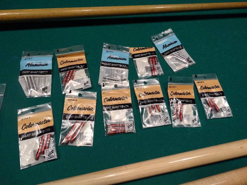 lot 698 image: 11 packages of new dart shafts - 3 per package.