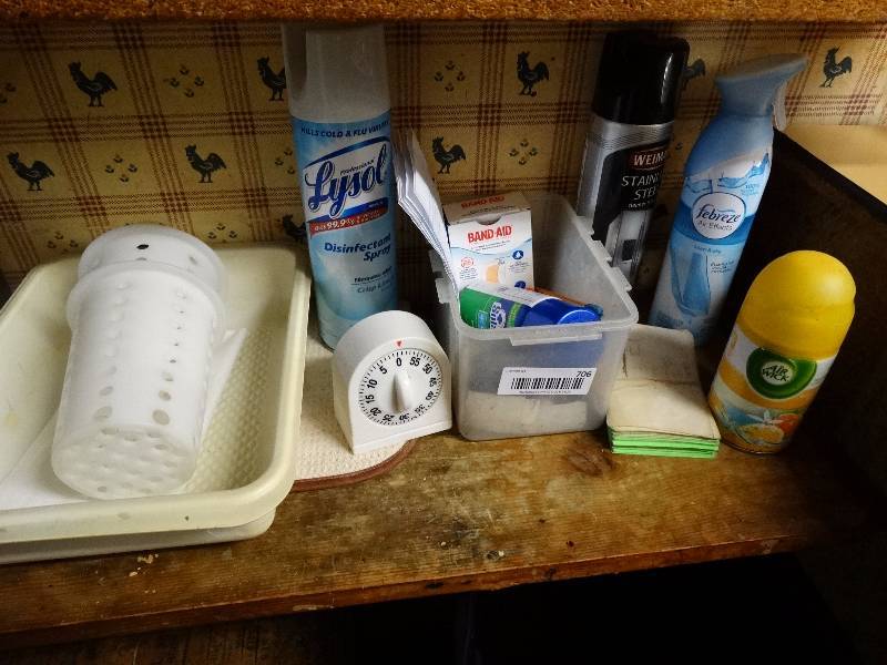 lot 706 image: Cleaners, air fresheners, timer, first aid items, etc.