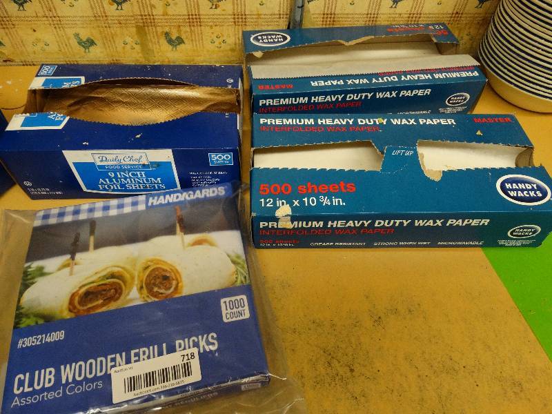 lot 718 image: Partial boxes of wax paper, foil sheets, & frill picks.
