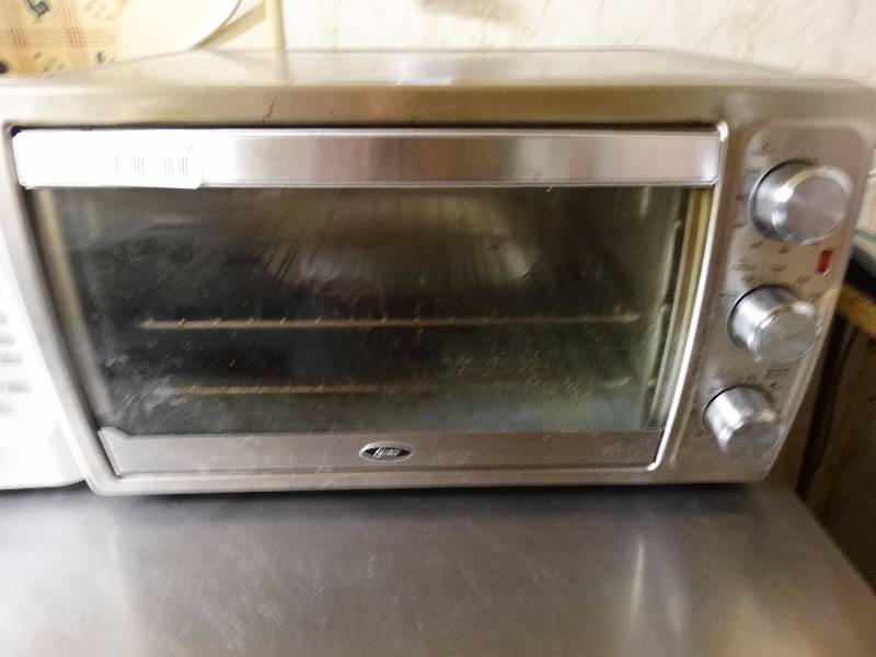 lot 734 image: Oster counter top convection oven.