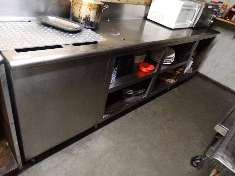 lot 737 image: Stainless Steel sandwich prep table wunder shelf storage. Contents not included.